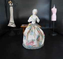 8" Antique Grey Hair Porcelain Half Doll, Floral  Skirt on Wire Cage. Flowers